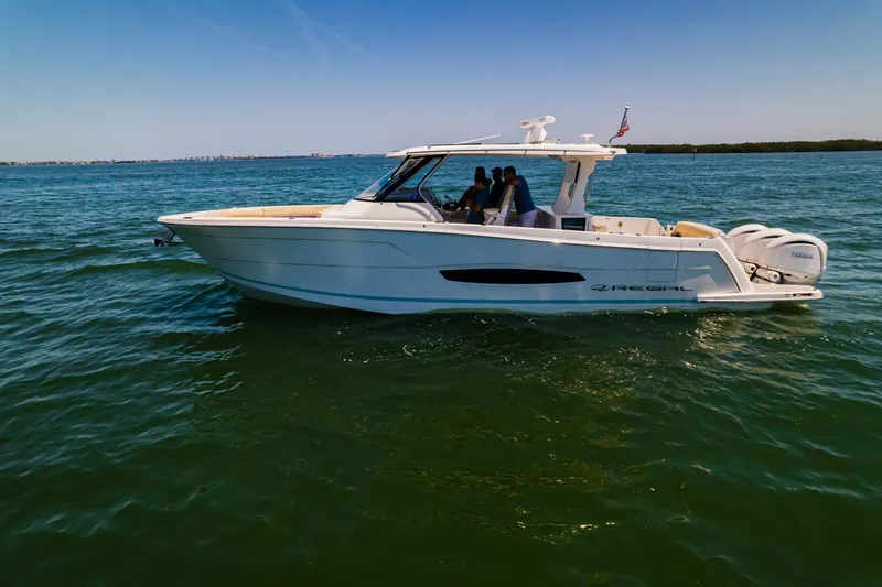My Honey Yacht Photos Pics 2023 Regal 38 SAV boat cruising on open water.