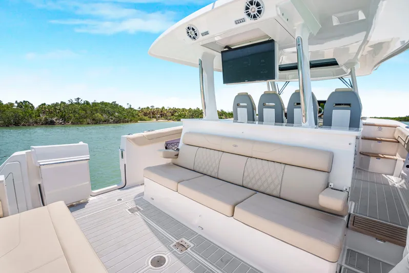 My Honey Yacht Photos Pics 2023 Regal 38 SAV boat interior with luxurious seating and modern amenities.