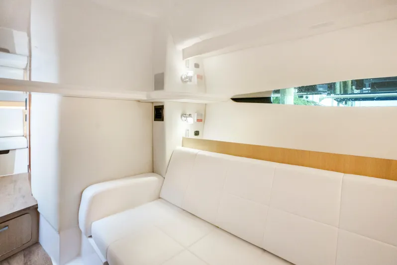 My Honey Yacht Photos Pics Interior of 2023 Regal 38 SAV yacht with white seating and modern design.