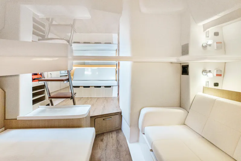 My Honey Yacht Photos Pics 2023 Regal 38 SAV interior with modern seating and wood flooring.