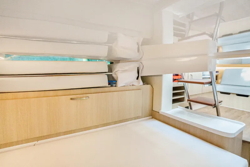 My Honey Yacht Photos Pics 2023 Regal 38 SAV interior cabin with modern design and wooden cabinetry.