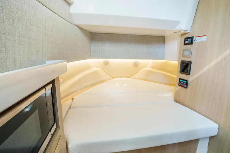 My Honey Yacht Photos Pics 2023 Regal 38 SAV interior cabin with modern design and ambient lighting.