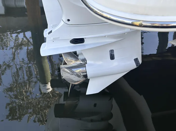 My Honey Yacht Photos Pics 2023 Regal 38 SAV boat propeller in water, showcasing sleek design and engineering.