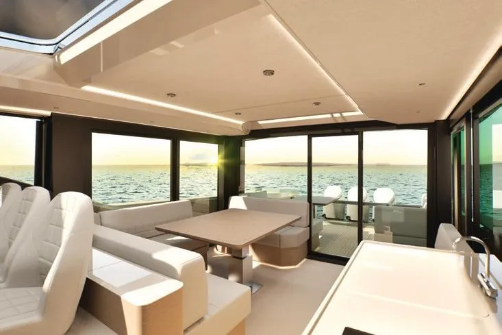  Yacht Photos Pics Luxurious interior of 2026 Saxdor 460 GTC yacht with ocean view at sunset.