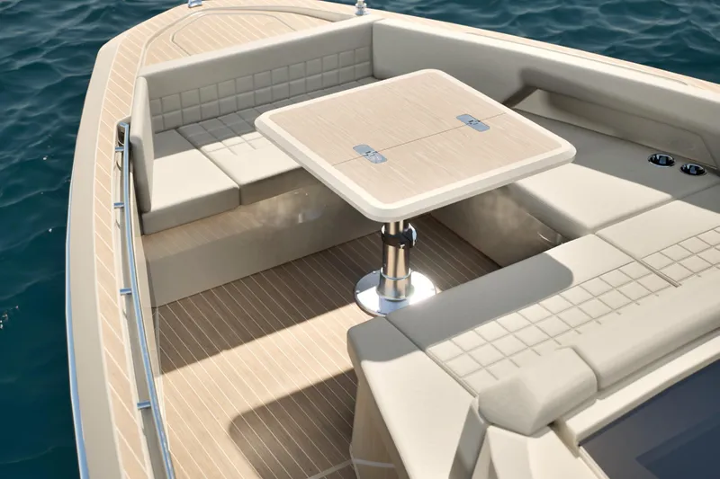  Yacht Photos Pics Luxurious seating area on 2026 Saxdor 460 GTC boat with elegant table and cushions.