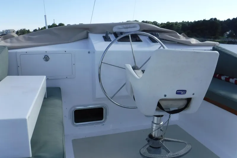  Yacht Photos Pics Helm of 1999 Custom Jack Gilbert 50 Trawler with steering wheel and seat.