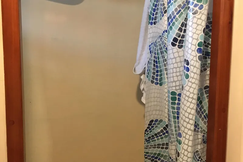  Yacht Photos Pics Shower area with patterned curtain on John Gilbert 50 Trawler, 1999 model.