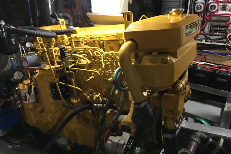 Yacht Photos Pics Engine room of 1999 Custom John Gilbert 50 Trawler with yellow machinery and wiring.