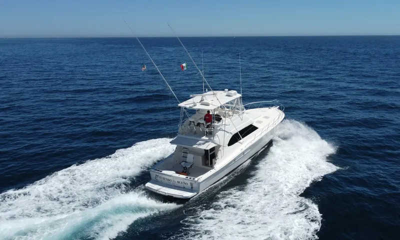 Viviendo El Sueño Yacht Photos Pics 2005 Riviera 51 yacht cruising on open sea, aerial view.