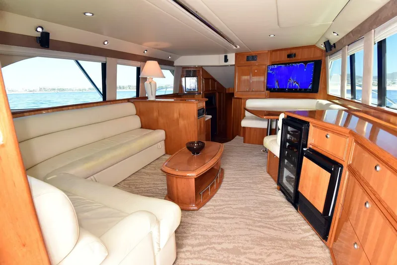 Viviendo El Sueño Yacht Photos Pics Luxurious interior of 2005 Riviera 51 yacht with elegant seating and modern amenities.
