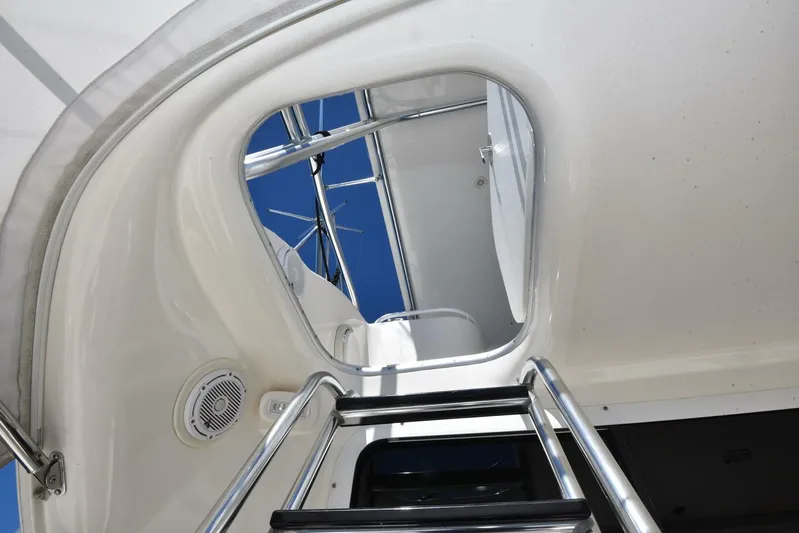 Viviendo El Sueño Yacht Photos Pics Stainless steel ladder on 2005 Riviera 51 yacht, leading to upper deck.