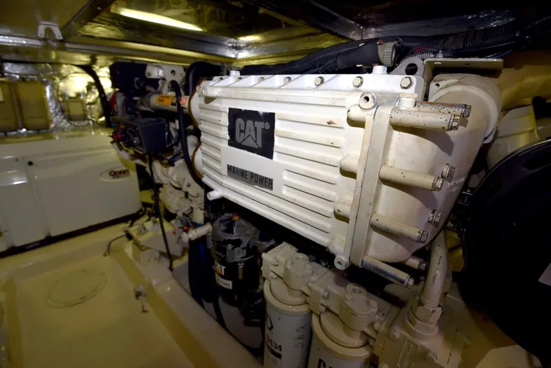 Viviendo El Sueño Yacht Photos Pics Engine room of 2005 Riviera 51 yacht with CAT marine power system.