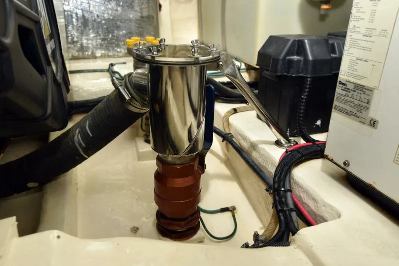 Viviendo El Sueño Yacht Photos Pics Engine room of 2005 Riviera 51 yacht, featuring mechanical components and wiring.