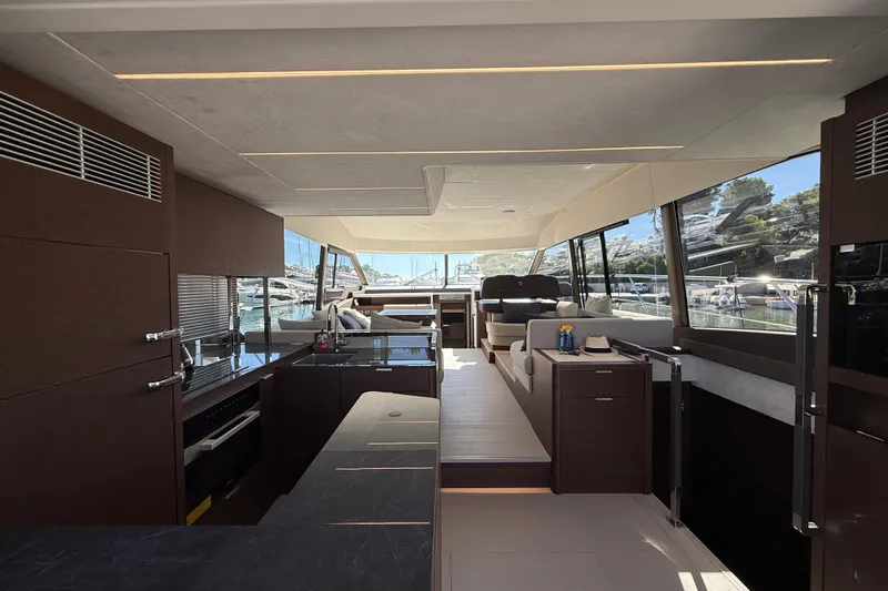  Yacht Photos Pics Luxurious interior of 2024 Prestige 590 yacht with modern design and panoramic windows.