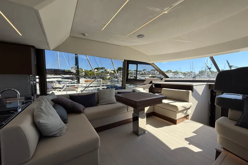  Yacht Photos Pics Luxurious interior of 2024 Prestige 590 yacht with elegant seating and panoramic windows.