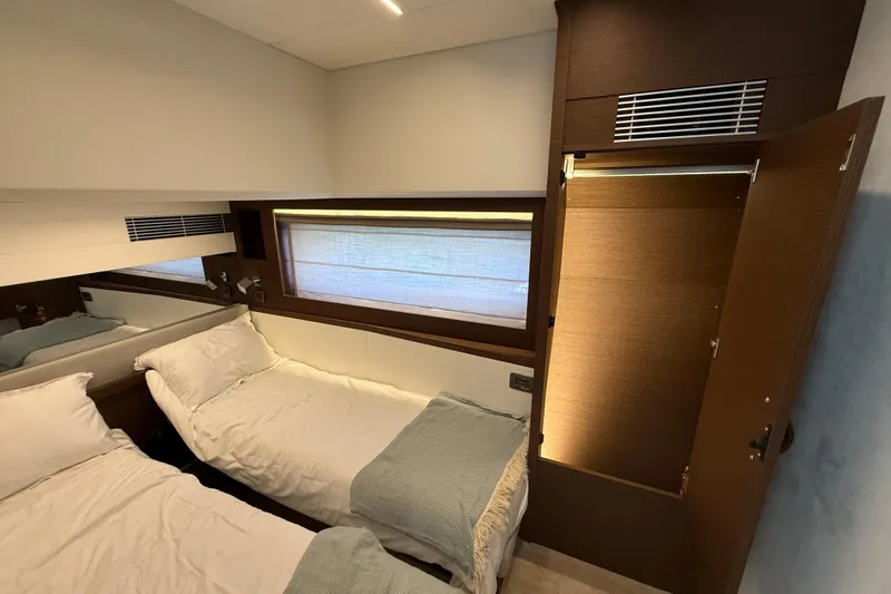  Yacht Photos Pics Luxurious cabin interior of 2024 Prestige 590 yacht with twin beds and modern decor.