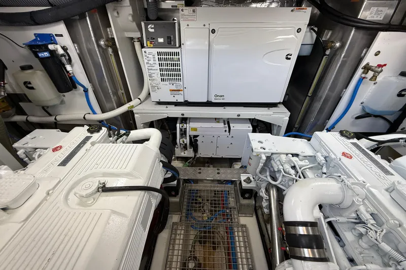  Yacht Photos Pics Engine room of 2024 Prestige 590 yacht with Cummins Onan generator and twin engines.