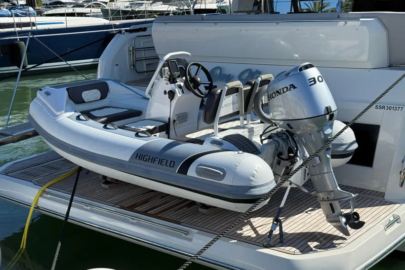  Yacht Photos Pics 2024 Prestige 590 yacht with Highfield tender and Honda outboard motor.