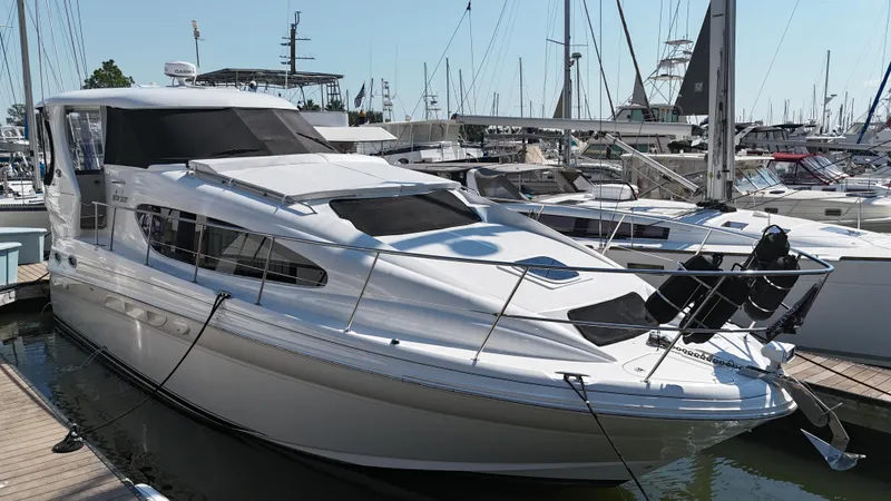 Debs Dinghy Yacht Photos Pics 2007 Sea Ray 40 Motor Yacht docked at marina, surrounded by other boats.