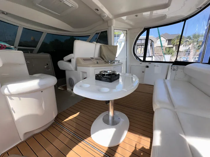 Debs Dinghy Yacht Photos Pics Interior of 2007 Sea Ray 40 Motor Yacht with white seating and wooden flooring.