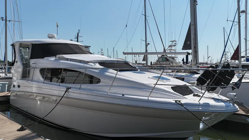 Debs Dinghy Yacht Photos Pics 2007 Sea Ray 40 Motor Yacht docked at marina, surrounded by sailboats.