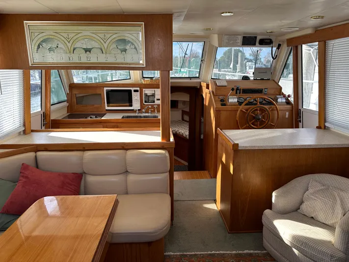  Yacht Photos Pics Interior of 2000 Mainship 43 Trawler Aft Cabin with cozy seating and helm.