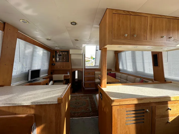  Yacht Photos Pics Interior of 2000 Mainship 43 Trawler Aft Cabin with wood finish and modern amenities.