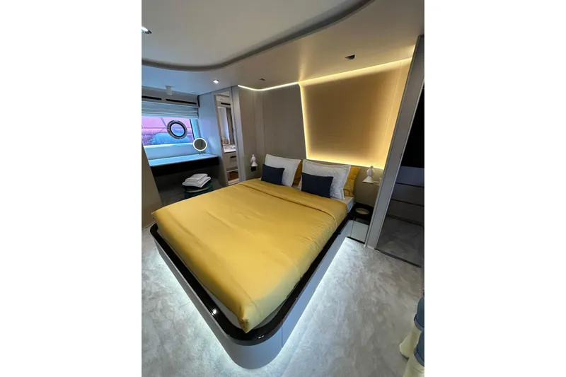  Yacht Photos Pics Luxurious bedroom interior of 2023 Azimut Fly 78 yacht with modern lighting and elegant design.