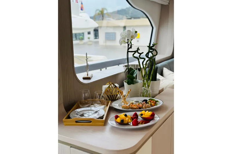  Yacht Photos Pics Luxurious dining setup on 2023 Azimut Fly 78 yacht with elegant decor and gourmet dishes.