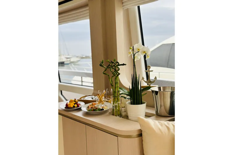  Yacht Photos Pics Luxurious interior of 2023 Azimut Fly 78 yacht with elegant dining setup and decor.