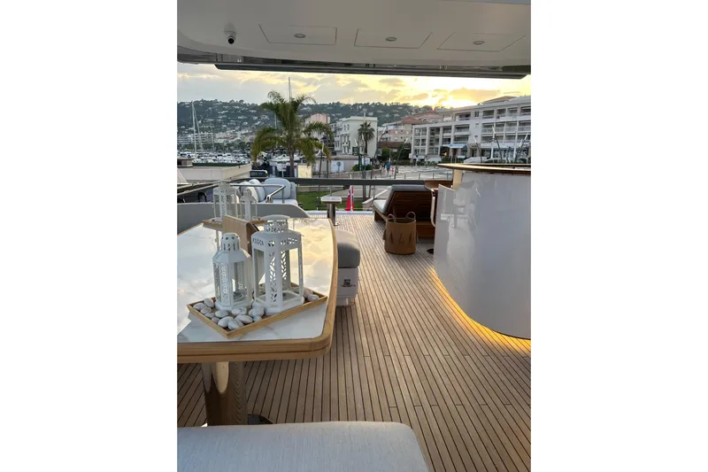 Yacht Photos Pics Luxurious 2023 Azimut Fly 78 yacht deck with elegant decor and scenic marina view.