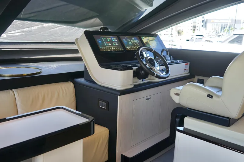  Yacht Photos Pics Luxurious interior of 2023 Azimut Fly 78 yacht with modern helm and seating.
