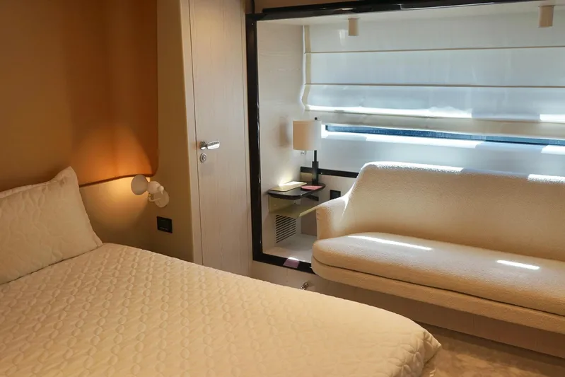  Yacht Photos Pics Luxurious interior of 2023 Azimut Fly 78 yacht with elegant bedroom and cozy seating area.
