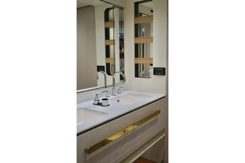  Yacht Photos Pics Luxurious bathroom interior of 2023 Azimut Fly 78 yacht with modern fixtures.