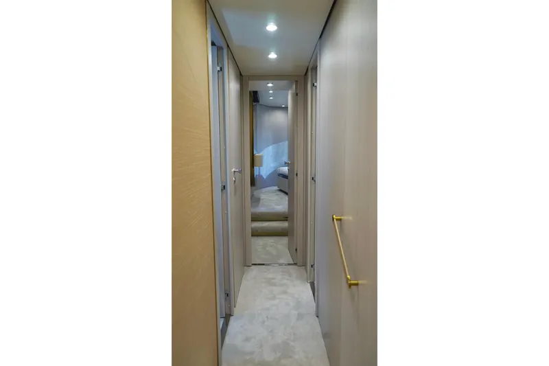  Yacht Photos Pics Interior hallway of 2023 Azimut Fly 78 yacht, featuring modern design and lighting.