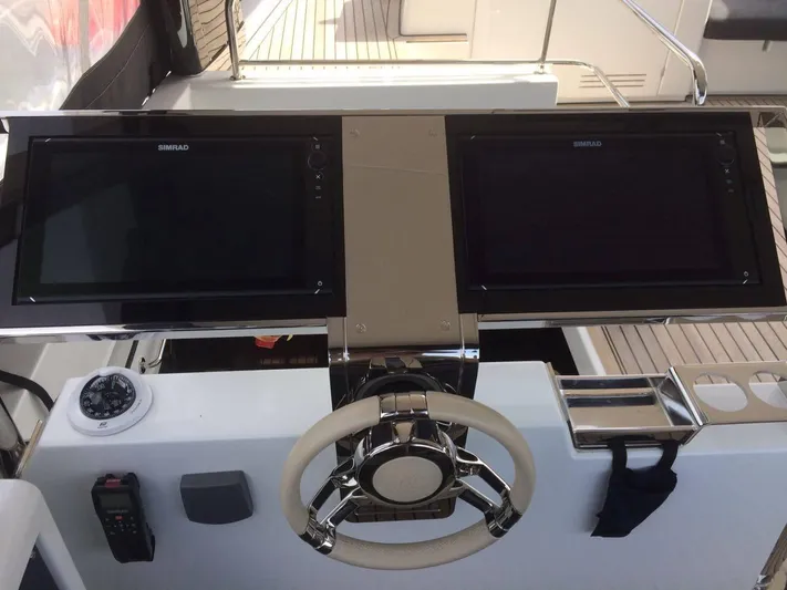  Yacht Photos Pics Helm of 2017 Lagoon 630 Motor Yacht with dual displays and modern controls.