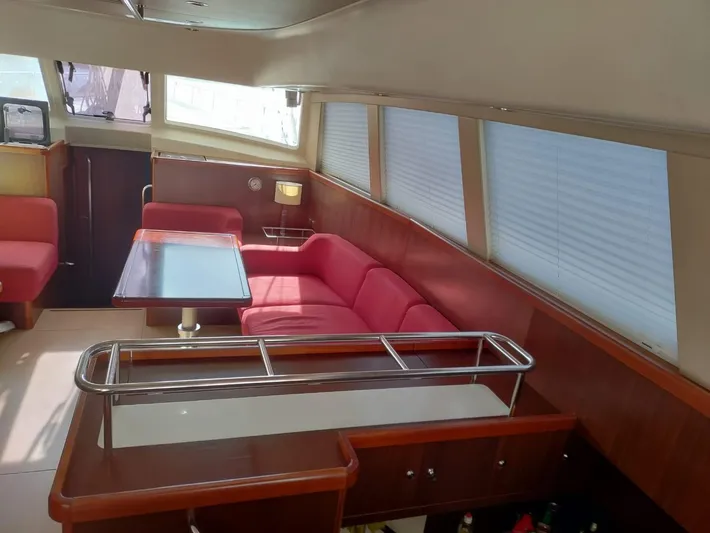 Felitsata II Yacht Photos Pics Interior of 2011 Moody 62 DS yacht with red seating and dining area.