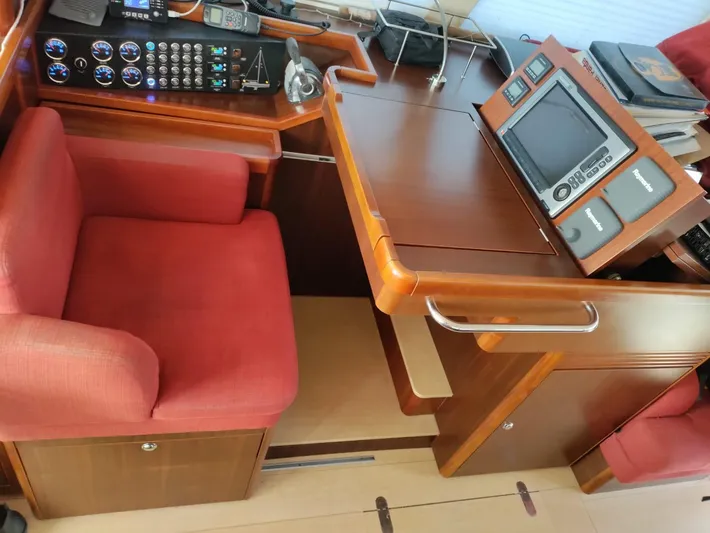 Felitsata II Yacht Photos Pics Luxurious Moody 62 DS yacht interior with navigation controls and red seating, 2011 model.