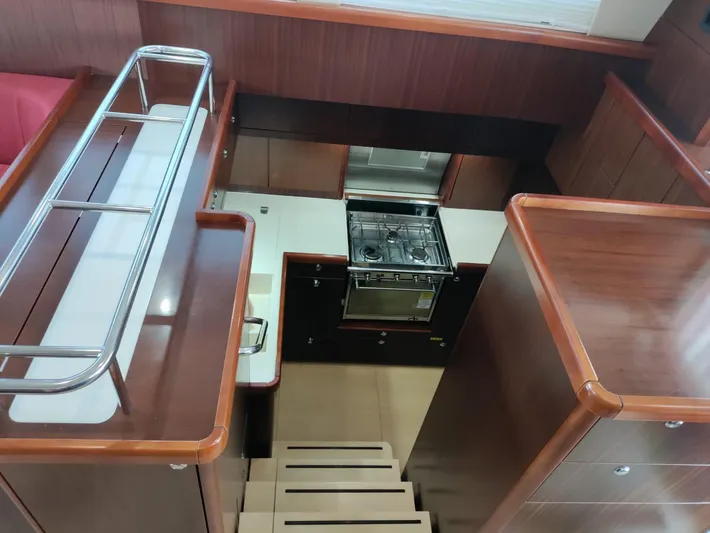 Felitsata II Yacht Photos Pics Interior of 2011 Moody 62 DS yacht, featuring a compact kitchen with wooden cabinetry.