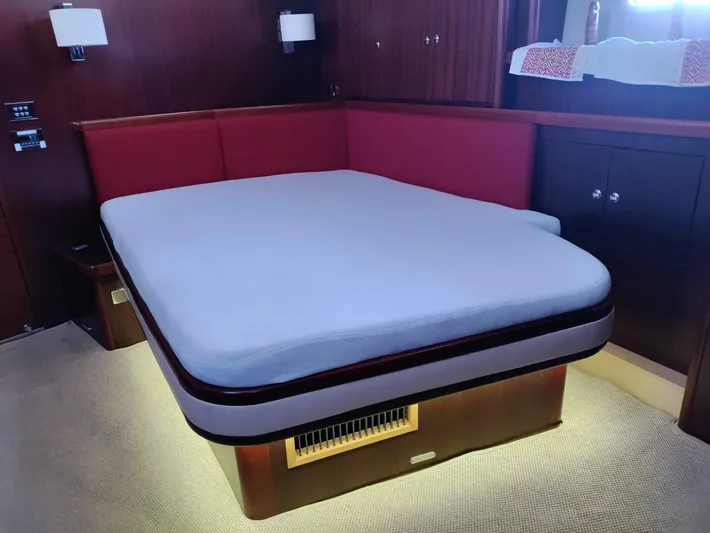 Felitsata II Yacht Photos Pics Luxurious Moody 62 DS 2011 yacht bedroom with modern lighting and elegant wood paneling.