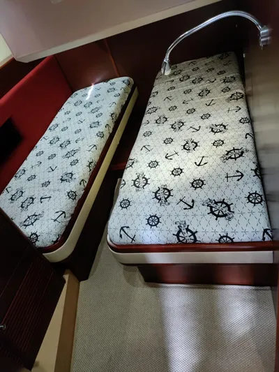 Felitsata II Yacht Photos Pics Interior of 2011 Moody 62 DS yacht with nautical-themed bedding.