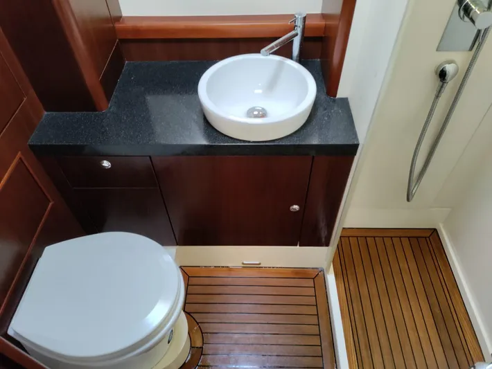 Felitsata II Yacht Photos Pics Luxurious bathroom in 2011 Moody 62 DS yacht with wood flooring and modern fixtures.