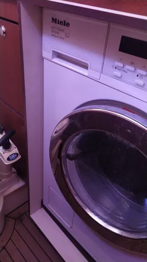 Felitsata II Yacht Photos Pics Miele washing machine in a 2011 Moody 62 DS yacht interior.