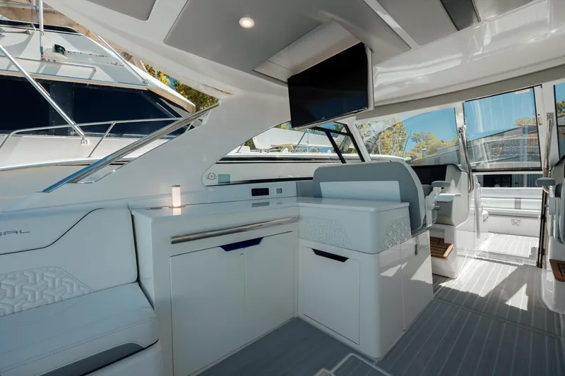  Yacht Photos Pics Luxurious interior of 2022 Regal LX36 yacht with modern seating and sleek design.