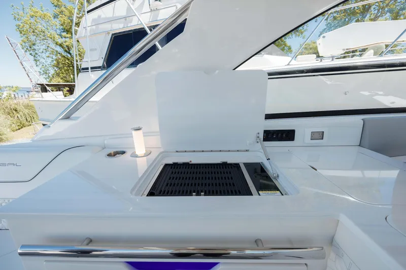  Yacht Photos Pics 2022 Regal LX36 yacht with sleek outdoor kitchen and grill setup.