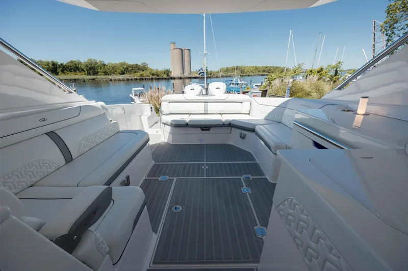  Yacht Photos Pics 2022 Regal LX36 boat interior with luxurious seating and scenic marina view.