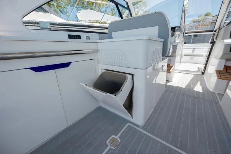  Yacht Photos Pics 2022 Regal LX36 boat interior with open storage compartment and modern design.