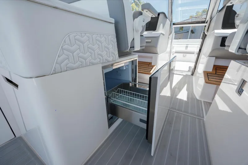  Yacht Photos Pics 2022 Regal LX36 yacht interior with open drawer, modern seating, and sleek design.
