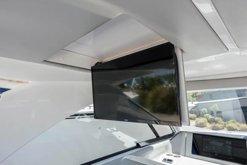  Yacht Photos Pics 2022 Regal LX36 yacht interior with mounted flat-screen TV.