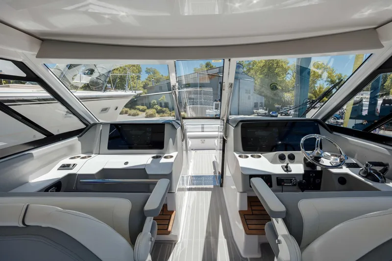  Yacht Photos Pics Interior view of 2022 Regal LX36 boat cockpit with modern controls and seating.